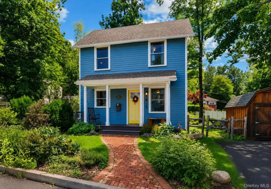 Two-story blue siding exterior with white trim Two-story blue siding exterior with white trim