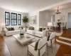 Virtually staged living room with gallery dining area in the background Virtually staged living room with gallery dining area in the background