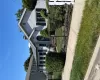 Siding exterior with black window shutters and a gabled roofline Siding exterior with black window shutters and a gabled roofline