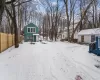 View of yard covered in snow View of yard covered in snow