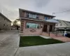 Brick facade with decorative banding, dual entryways, concrete driveway, and paved front walkway Brick facade with decorative banding, dual entryways, concrete driveway, and paved front walkway