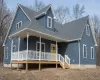 View of front of house with a large porch and roof with shingles View of front of house with a large porch and roof with shingles