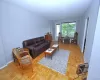 The large living room opens to the dining foyer, has parquet floors and a door to the private balcony. The living room is approx 23'-4" x 11'-2" plus the dining area of an additional 11'3" x 11'-3". The large living room opens to the dining foyer, has parquet floors and a door to the private balcony. The living room is approx 23'-4" x 11'-2" plus the dining area of an additional 11'3" x 11'-3".