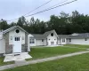 Ranch-style house featuring a front lawn Ranch-style house featuring a front lawn