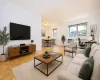 Photo visually staged. The living room has refinished parquet floor and is approx 19'-1" x 11'-5" plus the foyer of 9'-8" x 5'-6". The dining room is an additional 10'-2" x 7'-6"" Photo visually staged. The living room has refinished parquet floor and is approx 19'-1" x 11'-5" plus the foyer of 9'-8" x 5'-6". The dining room is an additional 10'-2" x 7'-6""