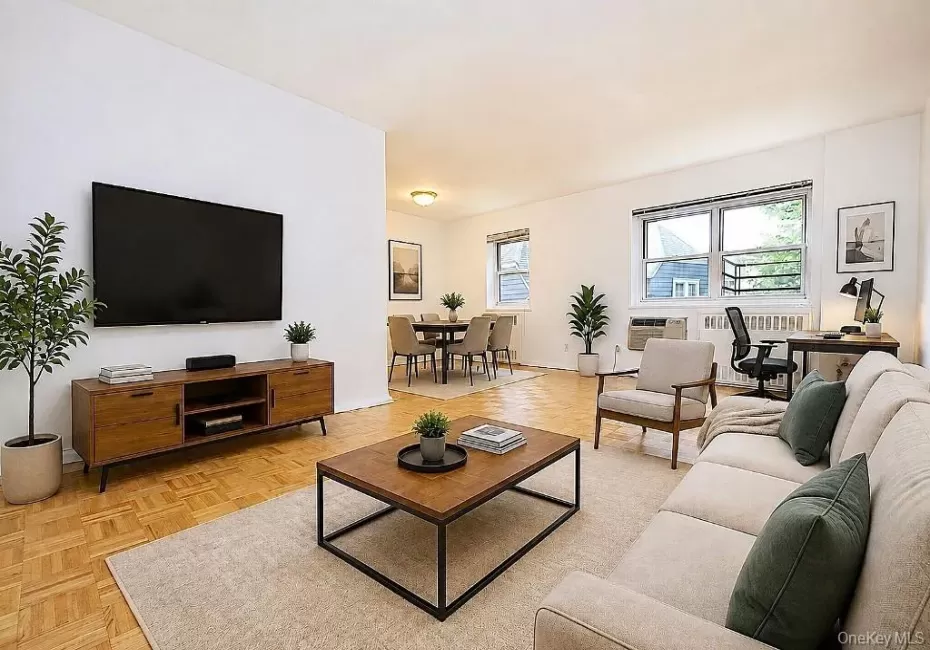 Photo visually staged. The living room has refinished parquet floor and is approx 19'-1" x 11'-5" plus the foyer of 9'-8" x 5'-6". The dining room is an additional 10'-2" x 7'-6"" Photo visually staged. The living room has refinished parquet floor and is approx 19'-1" x 11'-5" plus the foyer of 9'-8" x 5'-6". The dining room is an additional 10'-2" x 7'-6""