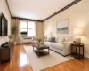 Photo Visually Staged. Sunny Living Room has hardwood floors, opens to the dining area and has Hudson River views. The living room is approx. 18'-11" x 11'-3". Photo Visually Staged. Sunny Living Room has hardwood floors, opens to the dining area and has Hudson River views. The living room is approx. 18'-11" x 11'-3".