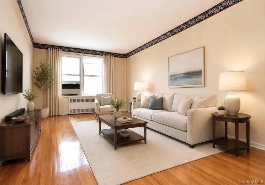 Photo Visually Staged. Sunny Living Room has hardwood floors, opens to the dining area and has Hudson River views. The living room is approx. 18'-11" x 11'-3". Photo Visually Staged. Sunny Living Room has hardwood floors, opens to the dining area and has Hudson River views. The living room is approx. 18'-11" x 11'-3".