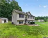 Split-level residence featuring light-colored siding and dark shutters Split-level residence featuring light-colored siding and dark shutters