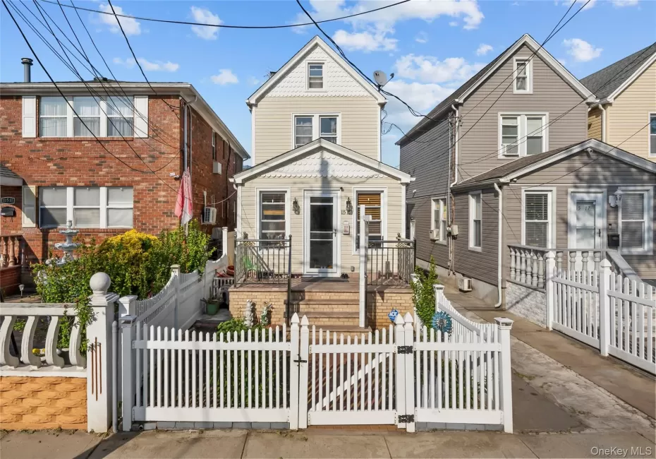 View of front of house featuring a gate and a fenced front yard View of front of house featuring a gate and a fenced front yard