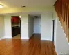 Unfurnished living room featuring hardwood / wood-style floors Unfurnished living room featuring hardwood / wood-style floors