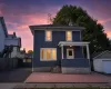 Two-story residence featuring blue siding and white trim Two-story residence featuring blue siding and white trim