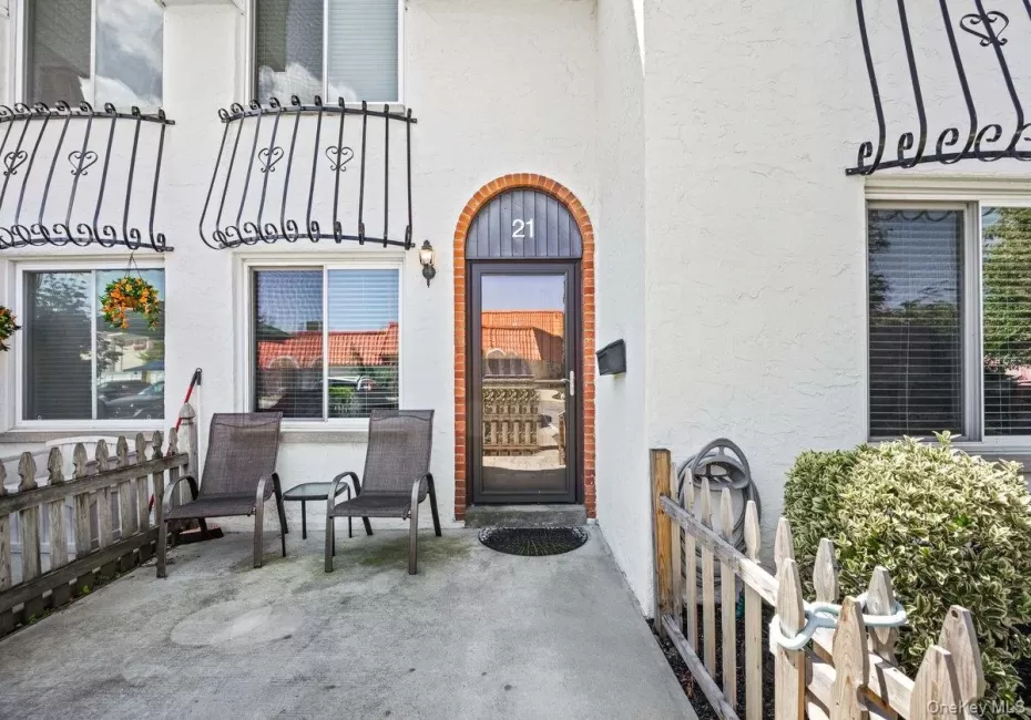 Arched brick entry with a glass-paneled door Arched brick entry with a glass-paneled door