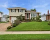 Split-level residence featuring a brick and siding exterior Split-level residence featuring a brick and siding exterior