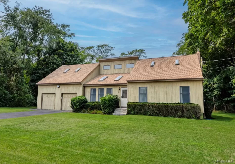 Contemporary-style home with cedar siding, and multiple skylights Contemporary-style home with cedar siding, and multiple skylights