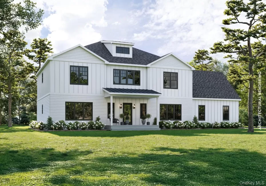 View of front of home with board and batten siding, a shingled roof, covered porch, and a front yard View of front of home with board and batten siding, a shingled roof, covered porch, and a front yard