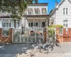 This beautiful multi-level home stands out with its eye-catching white iron gates, classic brick pillars, and a welcoming front porch. Shaded by mature trees and accented by matching window awnings, it offers great privacy and amazing curb appeal. This beautiful multi-level home stands out with its eye-catching white iron gates, classic brick pillars, and a welcoming front porch. Shaded by mature trees and accented by matching window awnings, it offers great privacy and amazing curb appeal.