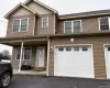 Two-story facade with horizontal siding and shake accents Two-story facade with horizontal siding and shake accents