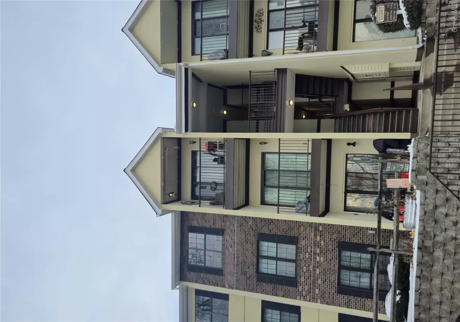 View of apartment building / complex featuring stairs View of apartment building / complex featuring stairs