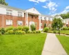 View of front of complex. Brick siding & beautiful green lawn View of front of complex. Brick siding & beautiful green lawn