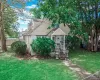 View of front facade with a shingled roof and covered porch View of front facade with a shingled roof and covered porch