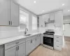 “Newly renovated kitchen with quartz countertops, shaker-style cabinetry and stainless steel appliances.” “Newly renovated kitchen with quartz countertops, shaker-style cabinetry and stainless steel appliances.”