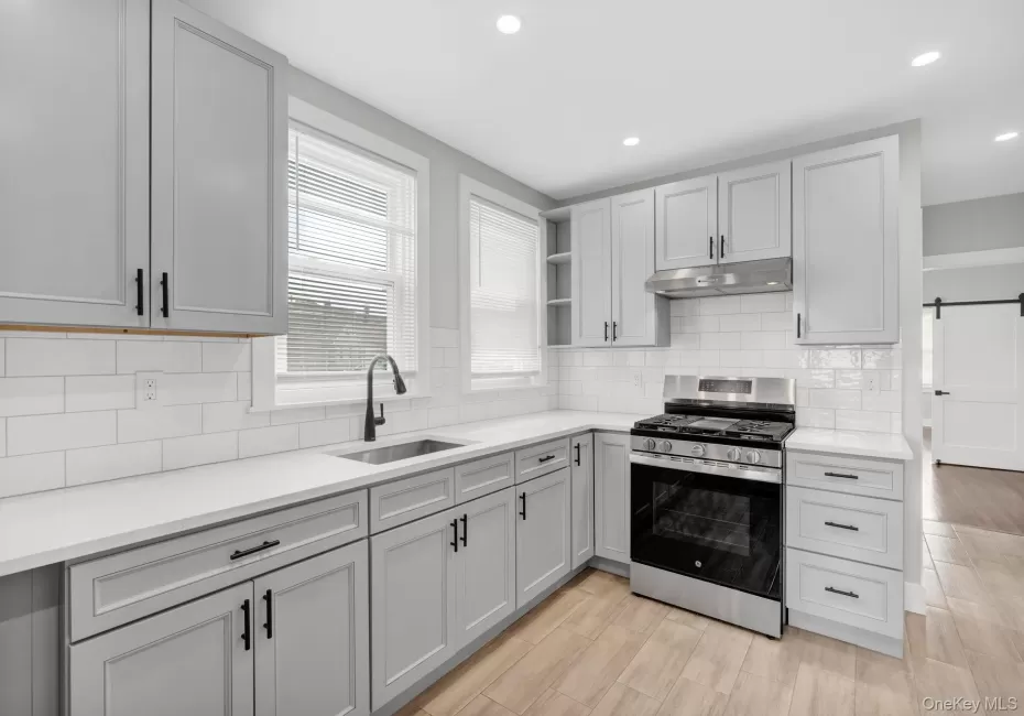 “Newly renovated kitchen with quartz countertops, shaker-style cabinetry and stainless steel appliances.” “Newly renovated kitchen with quartz countertops, shaker-style cabinetry and stainless steel appliances.”