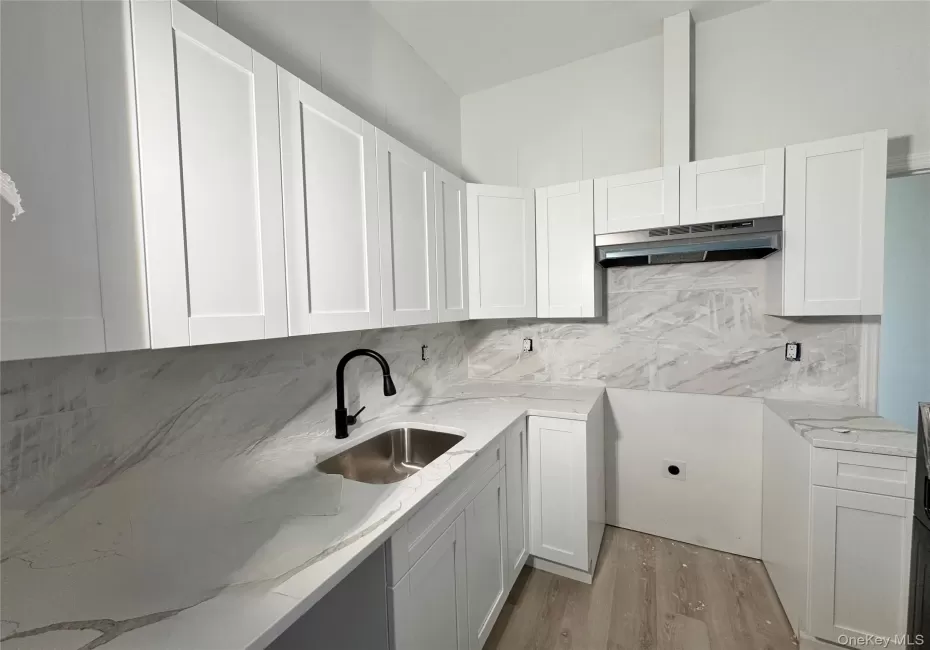 A Kitchen has quartz counters A Kitchen has quartz counters