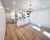 Light wood-finish flooring throughout, complemented by recessed ceiling lighting Light wood-finish flooring throughout, complemented by recessed ceiling lighting