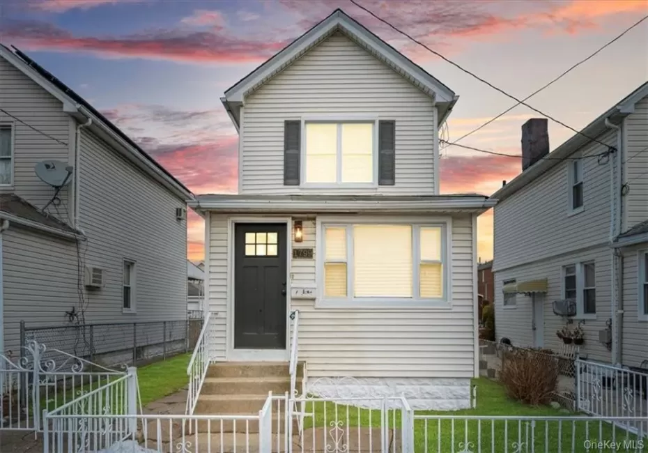 View of front of house with a fenced front yard and entry steps View of front of house with a fenced front yard and entry steps