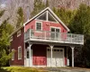 View of front facade featuring a garage, driveway, and view. View of front facade featuring a garage, driveway, and view.