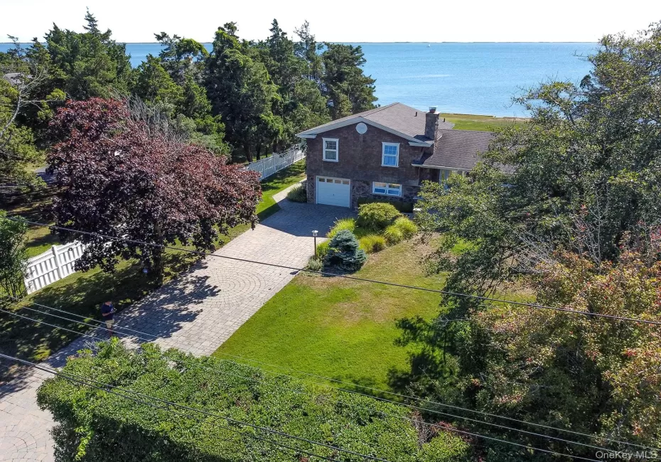 Birds eye view of property with a water view Birds eye view of property with a water view
