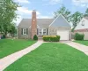 Stone and siding exterior with a prominent brick chimney, attached garage, and a paver walkway Stone and siding exterior with a prominent brick chimney, attached garage, and a paver walkway