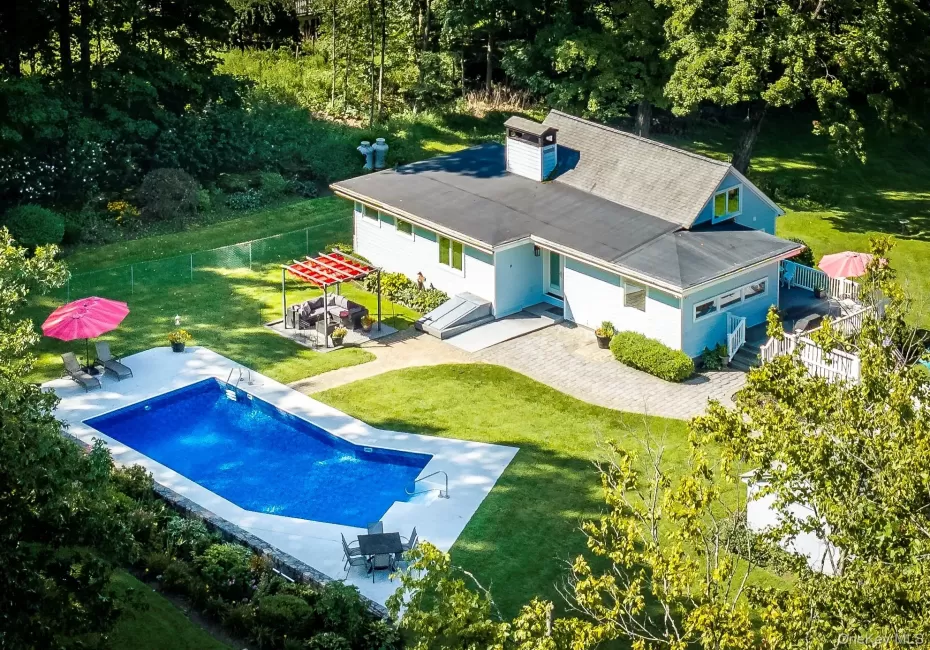 Set on over an acre and a half of pure enchantment, this charming predominantly one-level ranch-style home offers thoughtfully designed living space in a private and whimsical setting. Set on over an acre and a half of pure enchantment, this charming predominantly one-level ranch-style home offers thoughtfully designed living space in a private and whimsical setting.