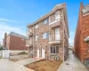 View of apartment building / complex with a garage View of apartment building / complex with a garage