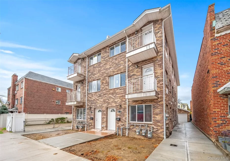 View of apartment building / complex with a garage View of apartment building / complex with a garage