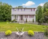 View of front of property featuring a front yard and a fire pit View of front of property featuring a front yard and a fire pit