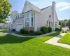 Charming single-family home featuring a brick and siding exterior with a peaked roofline and cupola Charming single-family home featuring a brick and siding exterior with a peaked roofline and cupola