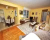 The large living room open to both the dining room and entrance foyer. The living room has hardwood floors and is approx 20'-0" x 12'-0". The large living room open to both the dining room and entrance foyer. The living room has hardwood floors and is approx 20'-0" x 12'-0".