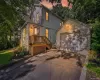 Twilight view of front. Including the detached garage and driveway Twilight view of front. Including the detached garage and driveway