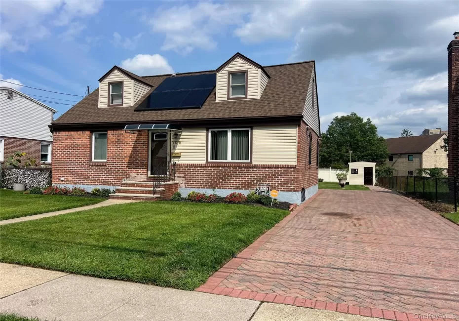 Brick and siding exterior with solar panels Brick and siding exterior with solar panels