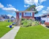 View of front of house with brick siding and a chimney View of front of house with brick siding and a chimney