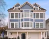 View of front of property with an attached garage, stucco siding, and a porch View of front of property with an attached garage, stucco siding, and a porch