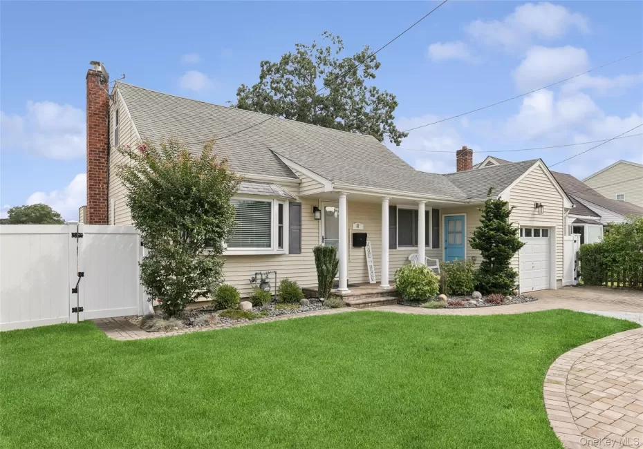 Siding exterior with a covered porch, bay window, and attached garage Siding exterior with a covered porch, bay window, and attached garage