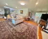 Hardwood flooring throughout, recessed lighting, skylight, and an open stairway with wrought iron balusters Hardwood flooring throughout, recessed lighting, skylight, and an open stairway with wrought iron balusters