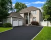 Exterior with brick facade, 2-car garage and wide driveway. Exterior with brick facade, 2-car garage and wide driveway.