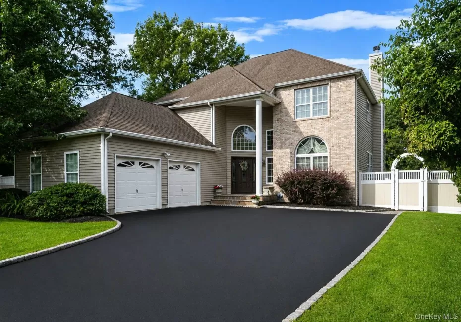 Exterior with brick facade, 2-car garage and wide driveway. Exterior with brick facade, 2-car garage and wide driveway.