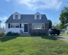 Cape Cod style house with vinyl and brick exterior Cape Cod style house with vinyl and brick exterior
