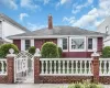 Red exterior siding with white window trim and shutters Red exterior siding with white window trim and shutters