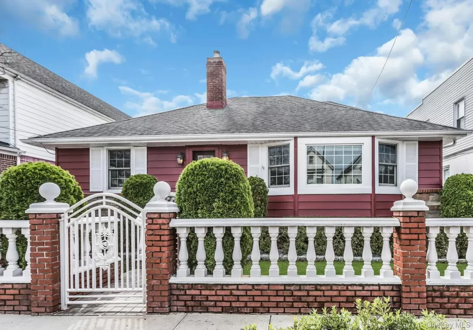 Red exterior siding with white window trim and shutters Red exterior siding with white window trim and shutters